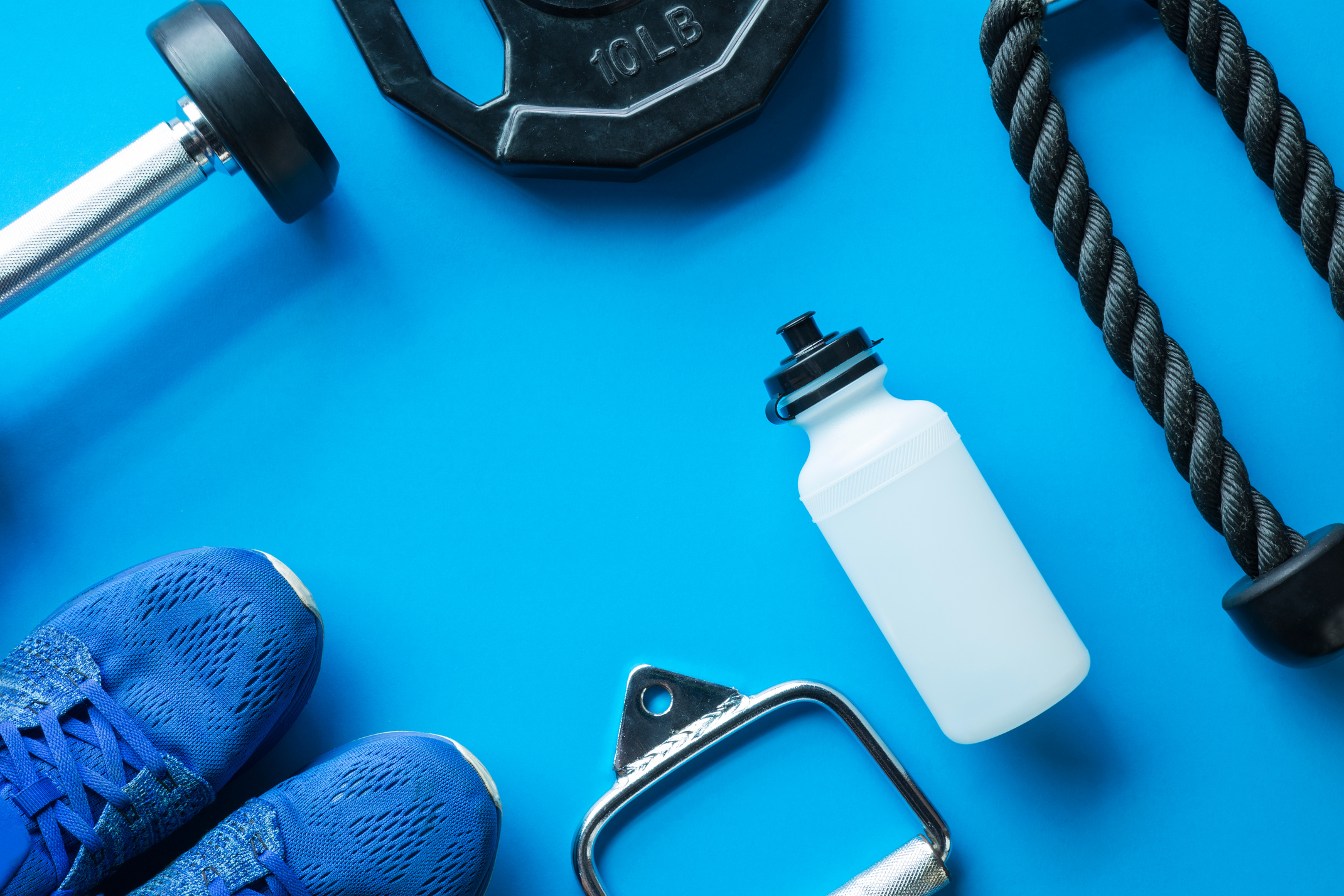 Fitness Gym equipment accessories on blue background
